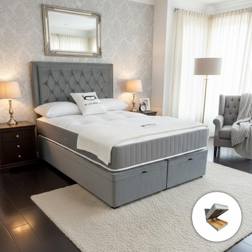 Gray upholstered bed with tufted headboard in a bedroom setting.