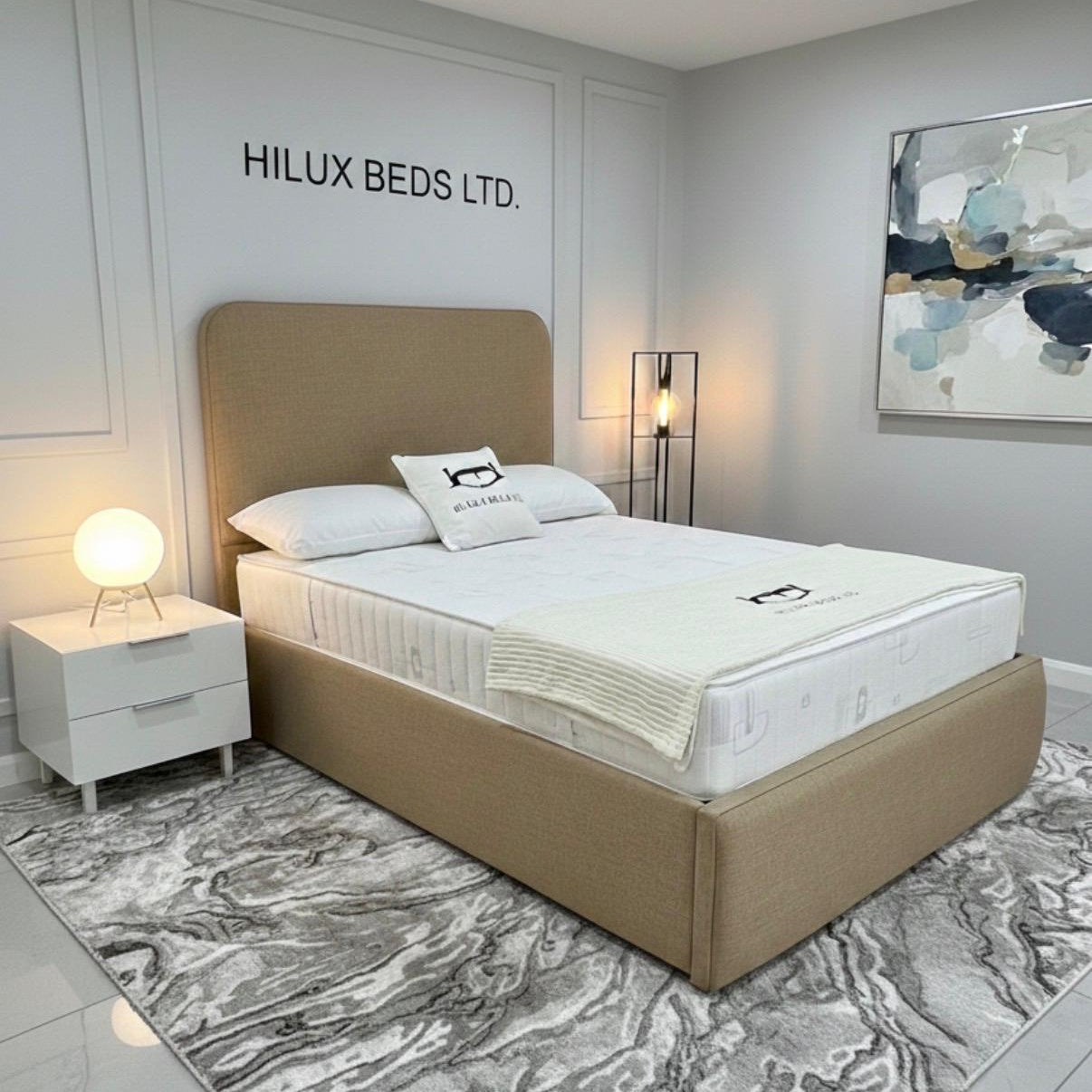 Bedroom with a bed and nightstand, featuring 'Hilux Beds Ltd.' branding.