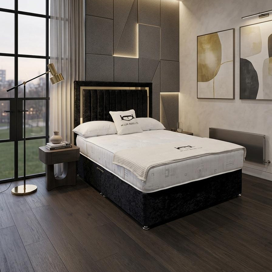 Modern bedroom with a bed, nightstands, and wall art.